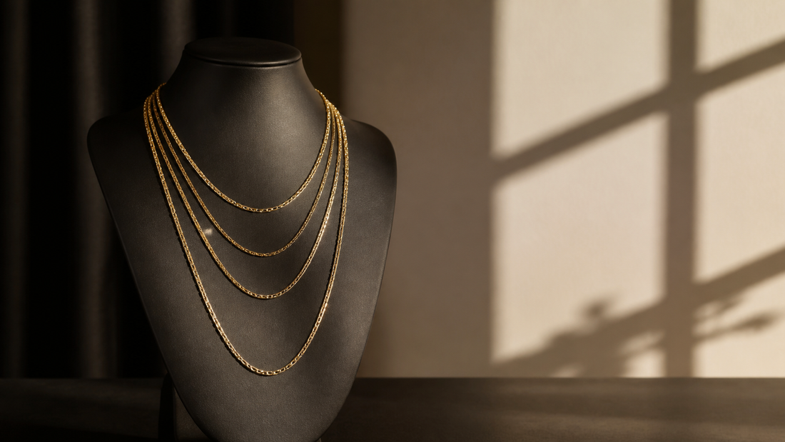 Four gold chains displayed at different necklace lengths