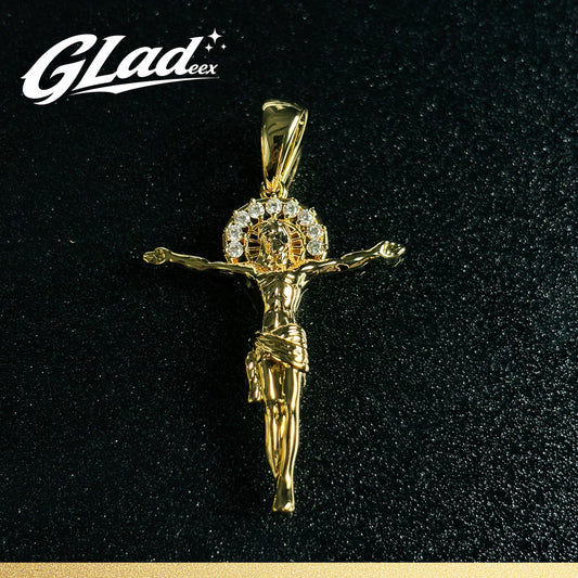 14K gold plated crucifix pendant with stone accents on a black surface