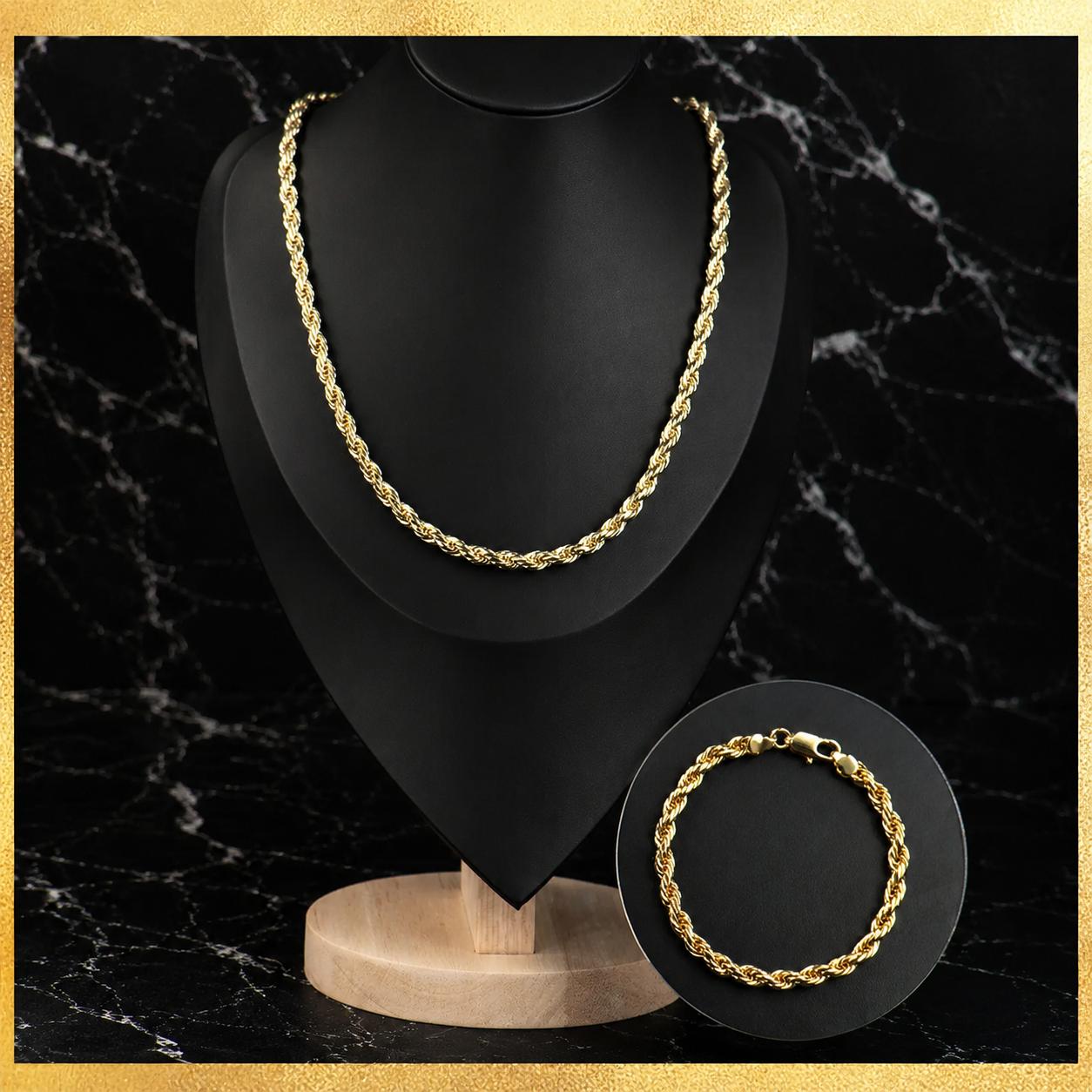 14K gold plated rope chain necklace and matching bracelet displayed on black marble
