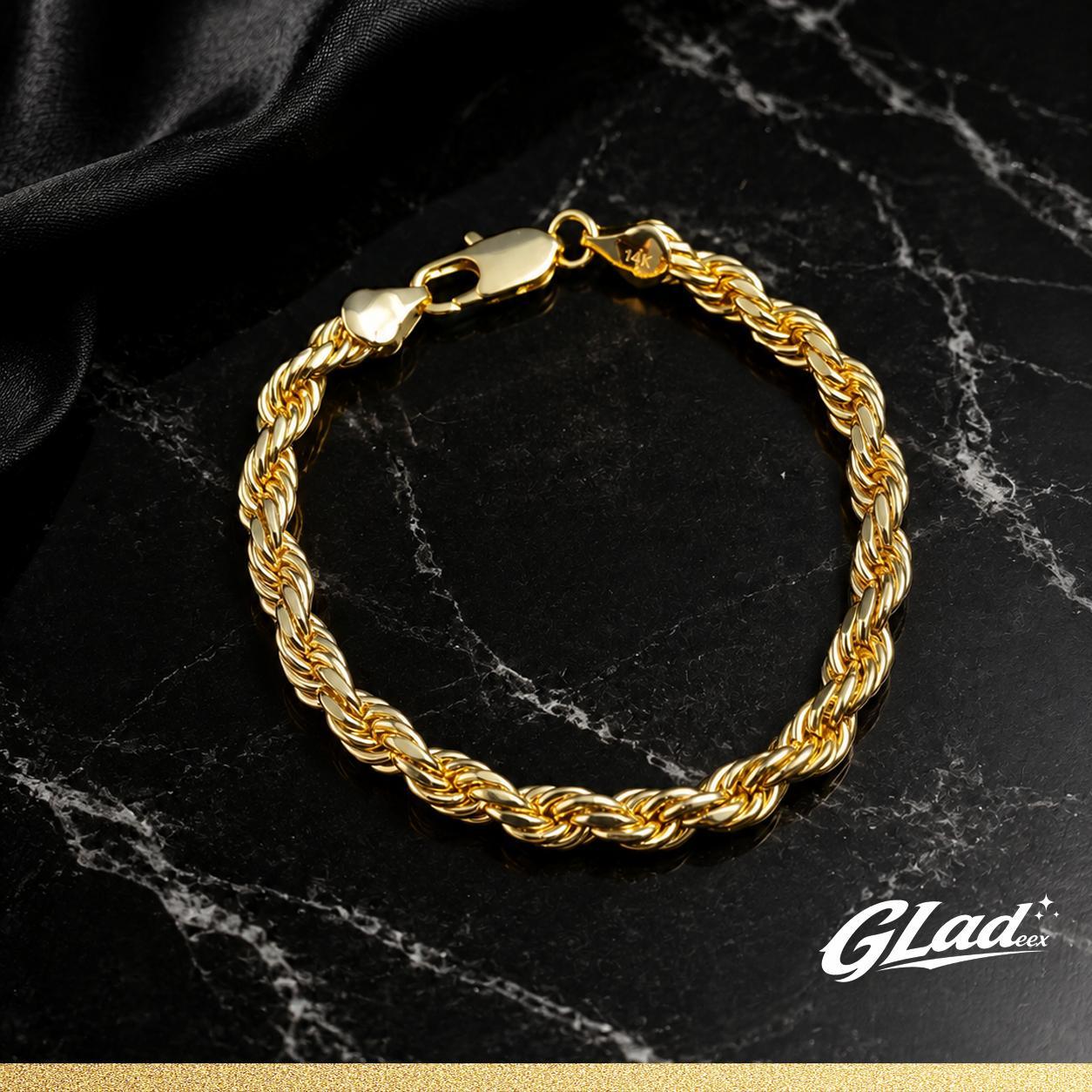 Women's 14K gold plated rope bracelet displayed on black marble