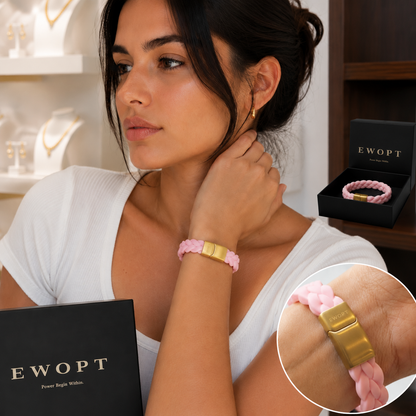 Woman wearing a pink silicone bracelet with a 14K gold plated clasp beside gift packaging